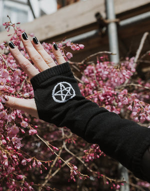 Black fingerless gloves with white pentagram pattern from Pamela Mann