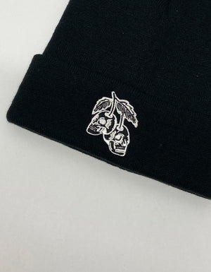 Close up of design embroidered black beanie