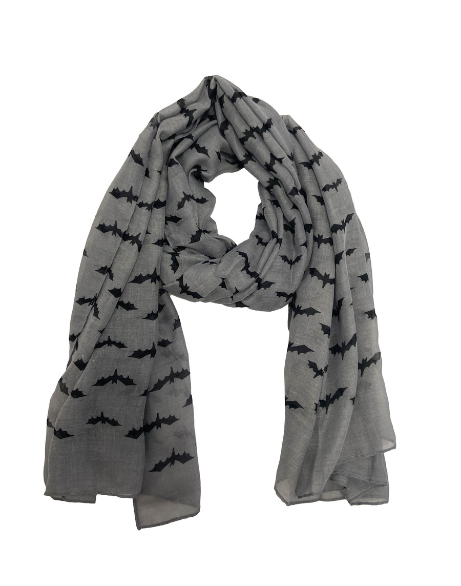 Model wearing grey/black bat printed scarf from Pamela Mann