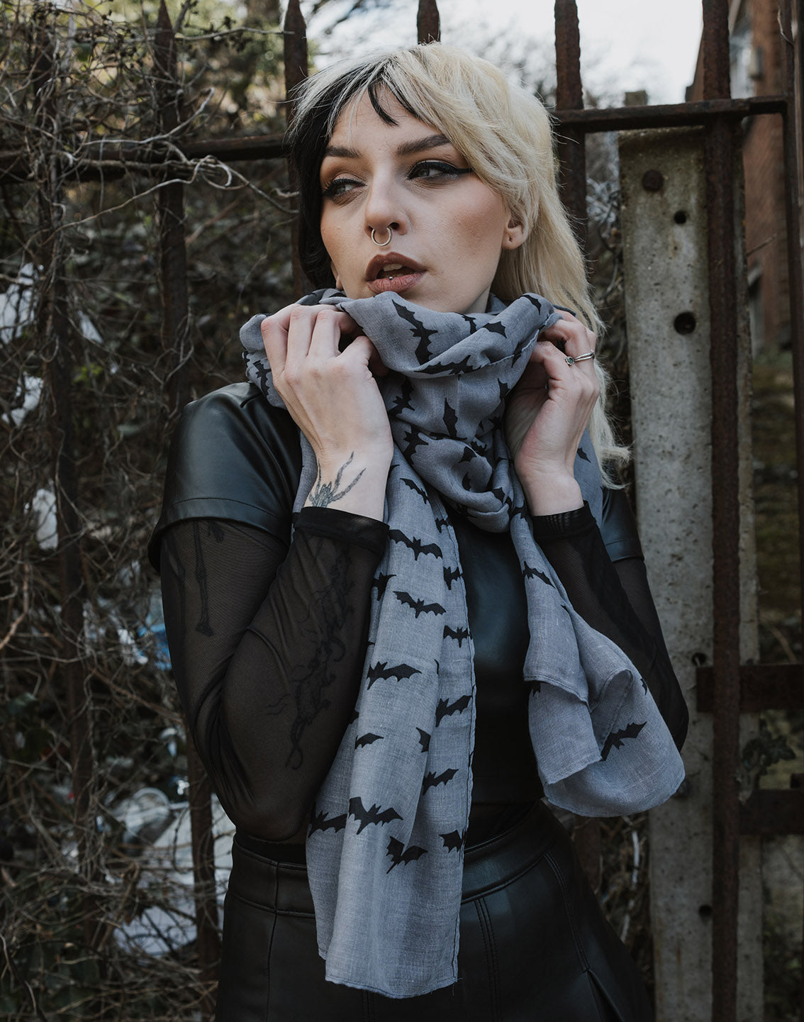 Model wearing grey/black bat printed scarf from Pamela Mann