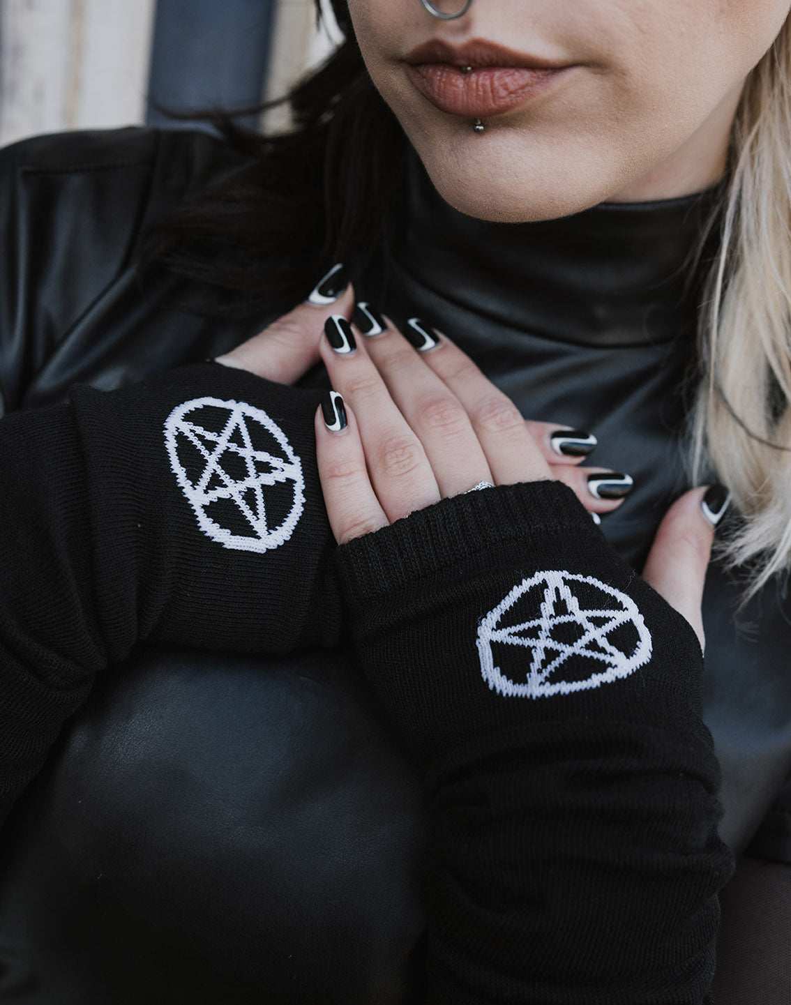 Black fingerless gloves with white pentagram pattern