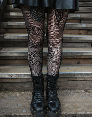 Fishnet tights with snake pattern from Pamela Mann's alternative tights wholesale collection